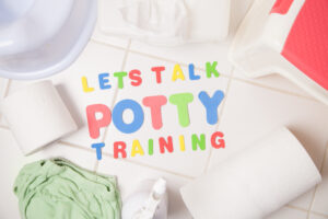 Lets Talk Bout Potty Training. Letters on a white onesie