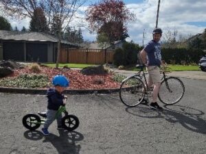 Carson and his Dad on their bikes together