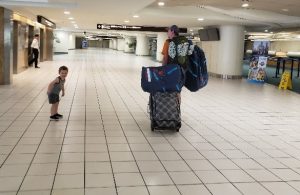 Carson and his dad walking through the airport