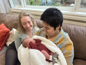 Family members holding baby Isaiah